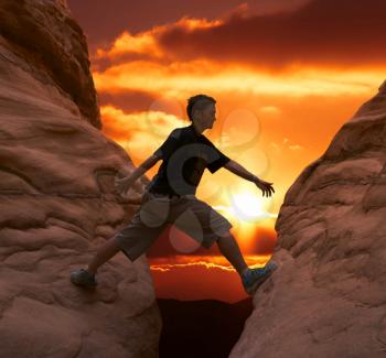 Royalty Free Photo of a Person Rock Climbing