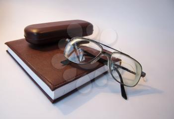 Royalty Free Photo of Glasses and a Book