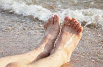 Royalty Free Photo of Bare Feet on a Beach