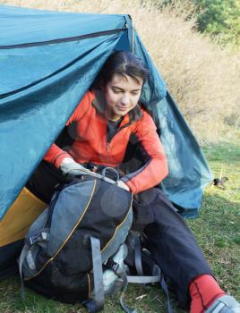 Royalty Free Photo of a Woman Sitting in a Tent