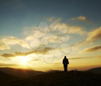 Royalty Free Photo of a Silhouette of a Person at Sunset