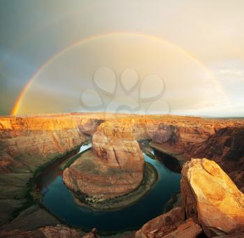 Royalty Free Photo of a Rainbow over Horseshoe Bend in Utah