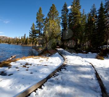 Royalty Free Photo of a Lake and Trail in the Snow