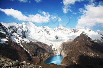 Royalty Free Photo of Snow Covered Mountains and a Lake in the Cordilleras