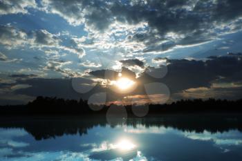Royalty Free Photo of a Sunrise Scene Over a Lake