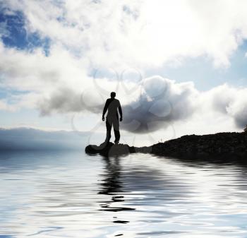 Royalty Free Photo of a Silhouette of a Man on a Lake