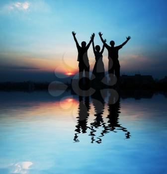 Royalty Free Photo of a Silhouette of Three Friends