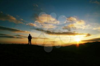Royalty Free Photo of a Silhouette of a Man at Sunset