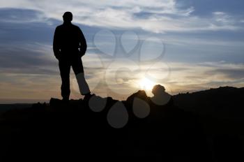 Royalty Free Photo of a Silhouette of a Man at Sunset