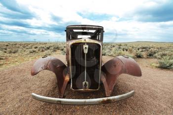 Royalty Free Photo of a Retro Rusted Car on Route 66