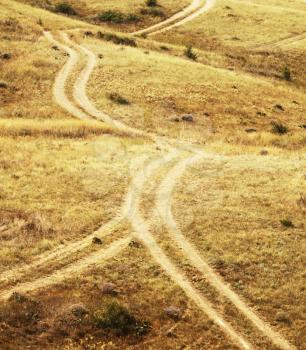 Royalty Free Photo of a Road in a Field