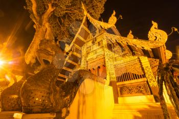 Night view buddhist temple in Chiang Mai, Northern Thailand.