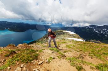 Hiking man in Canadian mountains. Hike is the popular recreation activity in North America. There are a lot of picturesque trails.