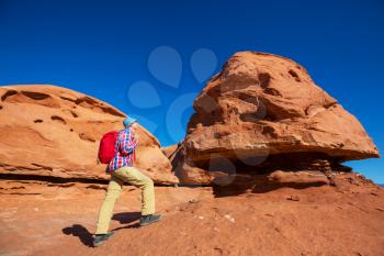 Hike in the Utah mountains. Hiking in unusual natural landscapes. Fantastic forms sandstone formations.
