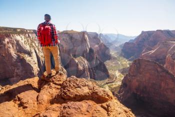 Hike in Zion National Park. Man walk on the trail  in Zion National park,Utah. Back turned no face visible.