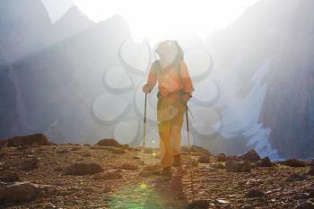 Wanderlust time. Man hiking in beautiful Fann mountains in Pamir, Tajikistan. Central Asia.