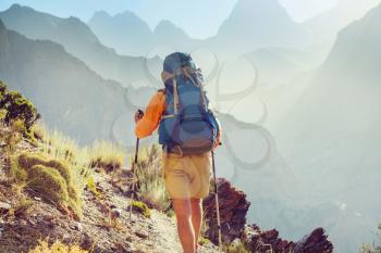 Wanderlust time. Man hiking in beautiful Fann mountains in Pamir, Tajikistan. Central Asia.