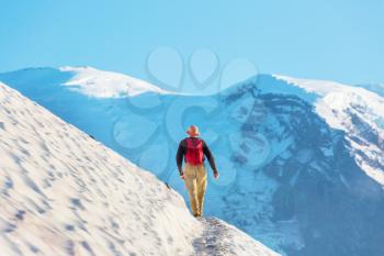 Backpacker in hike in the autumn mountains