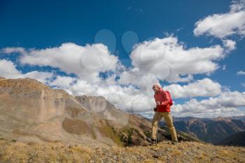 Man hiking in the Rocky mountains, Colorado in autumn season
