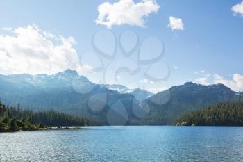 Serene scene by the mountain lake in Canada at sunset