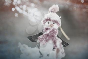 Snowman in winter background