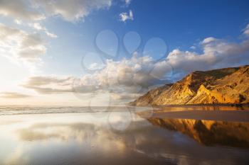 Beautiful Sunset at the Ocean Beach, New Zealand. Inspiring natural and travel background