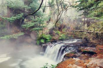 Thermal waterfall on Kerosene creek, Rotorua, New Zealand. Unusual natural landscapes