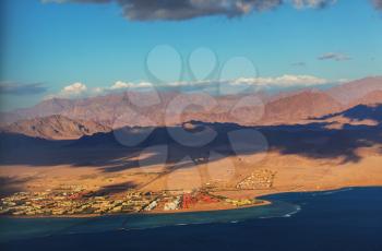 View from the airplane window of the mountains and sea resort of Egypt, Sharm El Sheikh