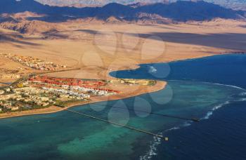 View from the airplane window of the mountains and sea resort of Egypt, Sharm El Sheikh