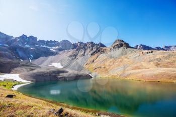 Serenity lake in the mountains in summer season. Beautiful natural landscapes.