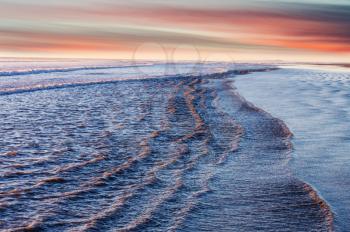 Blue wave on the beach. Dramatic natural background.