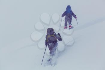 Hiker with snowshoes in winter