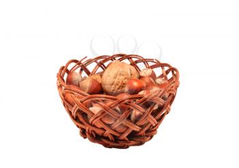 Walnut and wood nuts in a basket