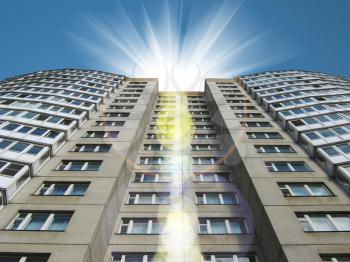 The high house against the sky and the sun