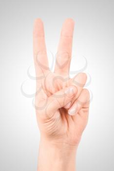 Royalty Free Photo of a Hand Making a Peace Sign