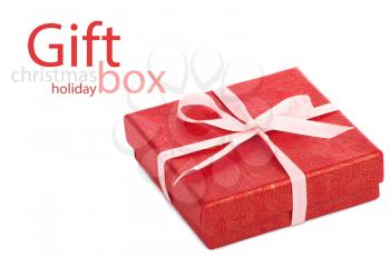Single red gift box with pink ribbon on white background.