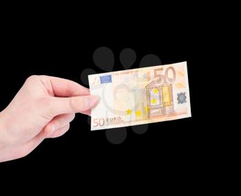 Money (Euro) in a hand isolated on black