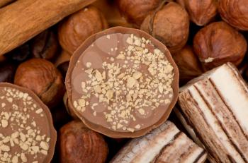 Closeup of coffee beans, cinnamon and nuts