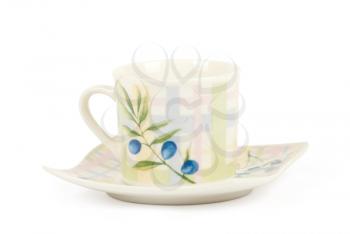 Fine china cup and saucer filled  isolated on white