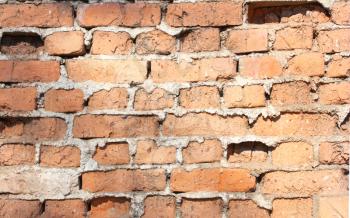 Old red with hollows a brick wall of the house a structure