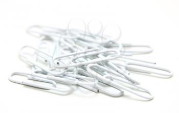 Color paper clips to background. Isolated on white background