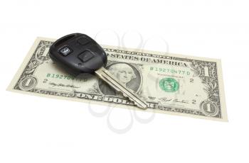 The car key lies on a dollar denomination isolated on white in a background
