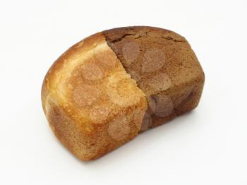Two halves of white and black bread lie on a white background