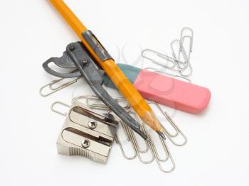 shot of eraser, pencil and pencil metal double sharpener on a white background