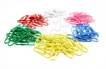 Color paper clips to background. Isolated on white background