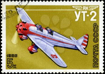 USSR - CIRCA 1986: A stamp printed in USSR shows the Aviation Emblem Yak and aircraft with the inscription UT-2, 1981 , circa 1986