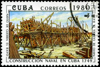 CUBA - CIRCA 1980: A stamp printed by the Cuban Post shows construction of a Cuban naval vessel El Rayo, built in 1749, circa 1980