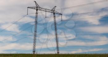 cloudy morning sky and a high-voltage line.