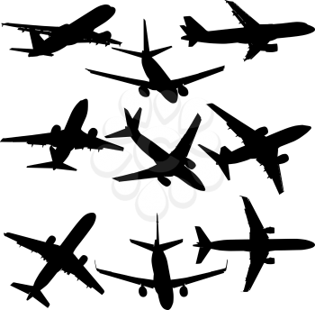 Set of silhouettes of planes from different eras on a white background.
