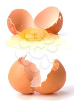 broken egg and empty eggshell isolated on white background